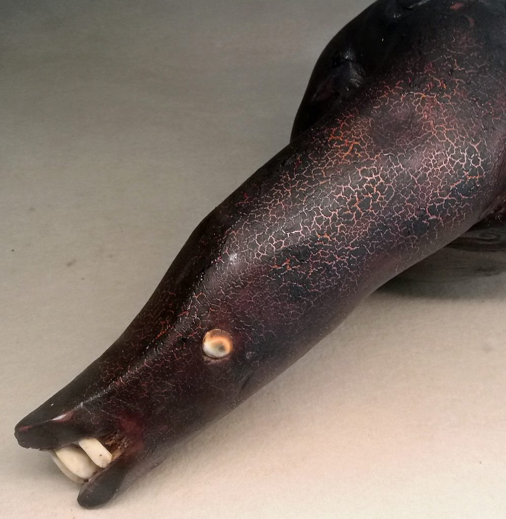 An example of the mix of rare artefacts in the Fiji Museum is this eel carving